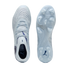 Top and bottom views of a light blue Puma soccer cleat with a textured upper, blue accents, and a translucent-studded soleplate.