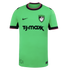 A bright green Nike soccer jersey featuring a T.J.Maxx sponsor logo, a Boston swan crest, and black and pink trim on the collar and sleeve cuffs.