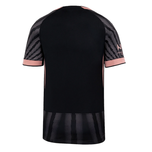 Back view of a black athletic jersey with pink trim and sleeve cuffs. The sleeves and bottom hem feature a gray and black striped pattern.