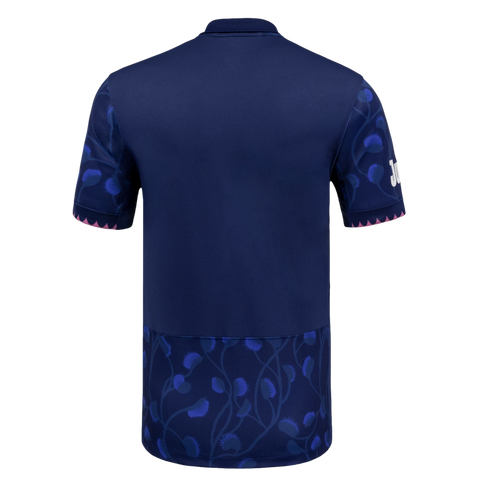 Back view of a navy blue polo-style jersey with light blue thistle patterns on the sleeves and bottom hem, and pink jagged trim on the sleeve cuffs.