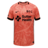 Peach soccer jersey with an abstract pattern and black Nike, 'B.F.C' gothic, and Sutter Health logos. Black trim on collar and sleeves.