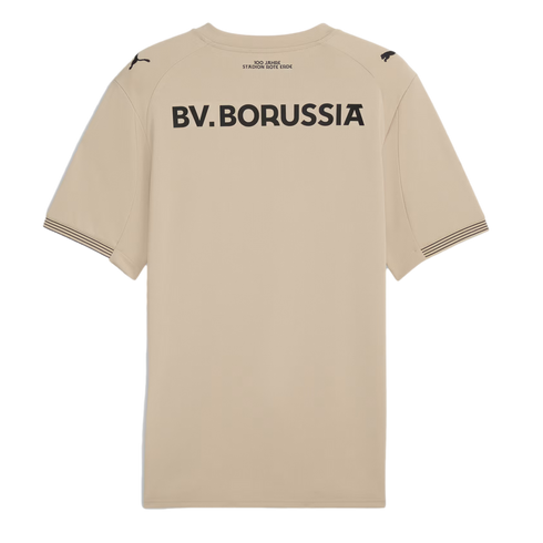 Back of a beige football jersey with "BV. BORUSSIA" in black. Includes commemorative text above, Puma logos on shoulders, and striped sleeve cuffs.