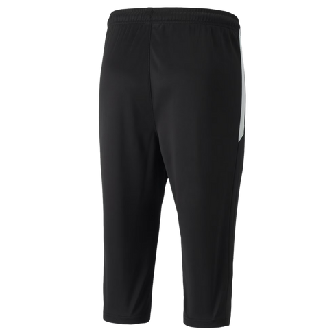 A rear view of three-quarter length black athletic training pants featuring an elastic waistband and a white panel on the right side.