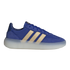 A side profile of a blue Adidas sneaker featuring gold three-stripes and a thick, semi-translucent white midsole. The shoe's upper is made of a mix of blue suede and fabric, with matching blue laces.