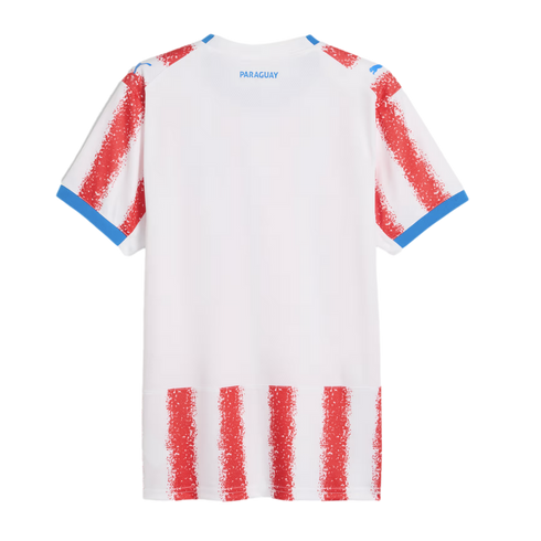 Back view of a white Paraguay soccer jersey with red textured stripes, blue trim on sleeves and shoulders, and "PARAGUAY" printed in blue on the upper back.