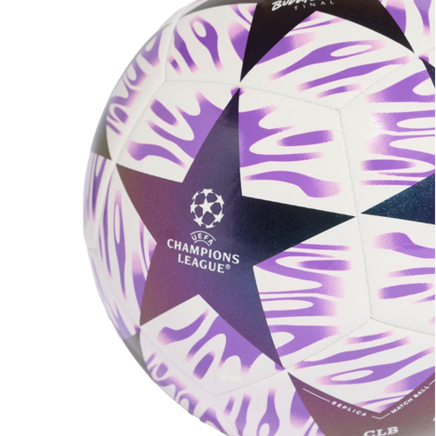 Close-up of a UEFA Champions League replica soccer ball with white, purple, and black star-patterned design.