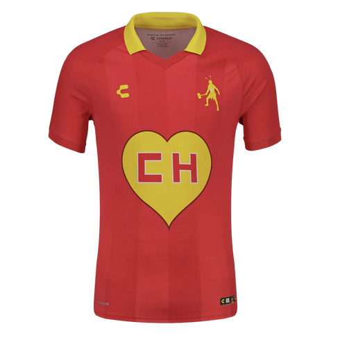 Red Charly soccer jersey with a yellow collar, featuring a large yellow heart with "CH" on the chest and a yellow silhouette of El Chapulín Colorado on the upper left.