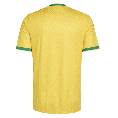 Back view of a yellow short-sleeved jersey featuring a subtle tonal chevron pattern and green trim on the crew neck and sleeve cuffs.