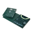 A dark green Manchester City football jersey with a geometric pattern and lime green collar, presented in its matching collector's box against a black background.