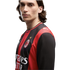 A man with long dark hair wearing a red and black striped AC Milan jersey against a white background.