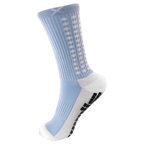Light blue and white crew-length athletic sock with black non-slip grip pads on the sole and white rectangular details along the side.