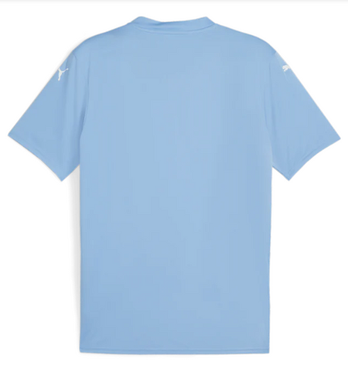 Back view of a light blue short-sleeved sports jersey with white Puma logos on both shoulders, shown flat against a white background.