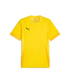 A yellow, short-sleeved Puma sports t-shirt with a black logo on the chest and breathable mesh panels on the sides and sleeve cuffs.