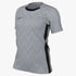 Women's Nike gray short-sleeved athletic jersey with tonal zigzag patterns, black crew neckline, black side stripes, and a black swoosh logo on the right chest.