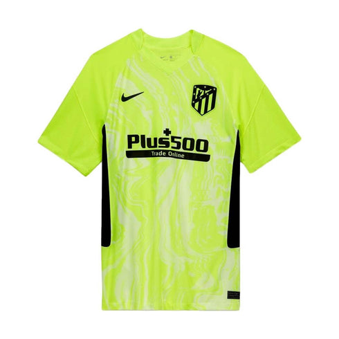Lime green Nike Atlético de Madrid soccer jersey featuring a black Plus500 sponsor logo, team crest, and a subtle swirl pattern on the front.